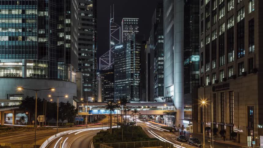 Traffic moving through a large city at night