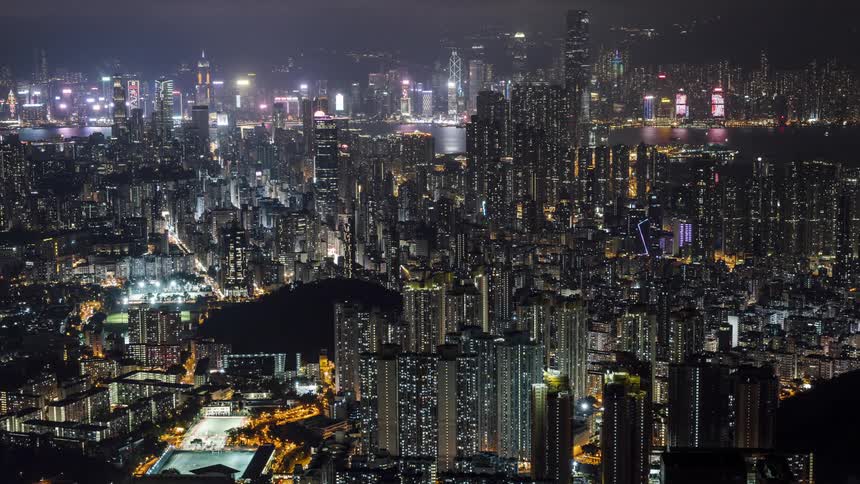 The downtown and city skyline lights shimmer and flash at night