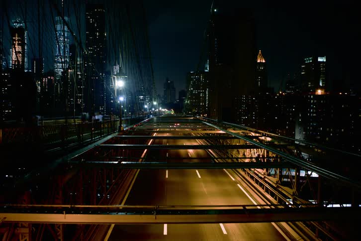 Time lapse of city traffic over bridge at night