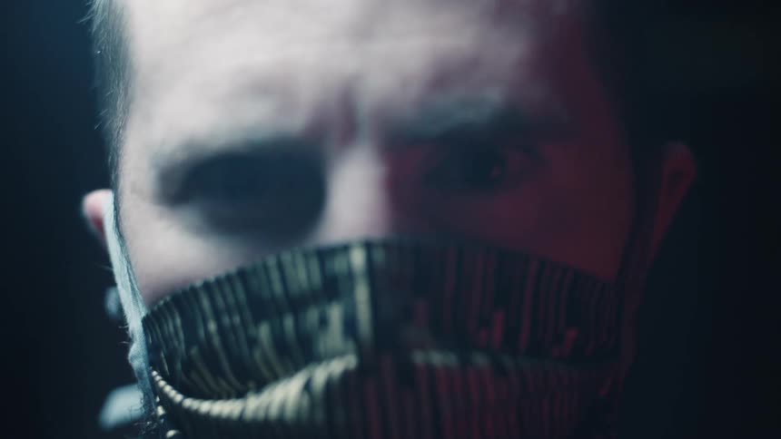 A man puts on a face mask