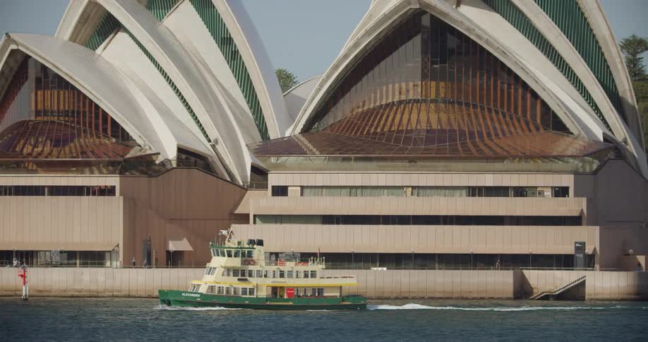 Ferryboat sails past the sydney opera house in sydney new south wales australia