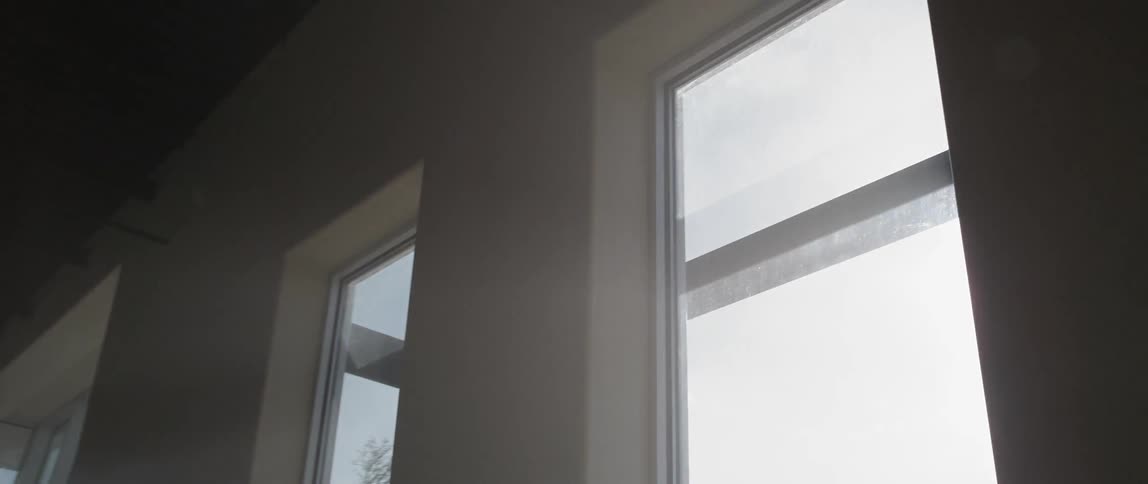 Sun is shining through windows into a dark home