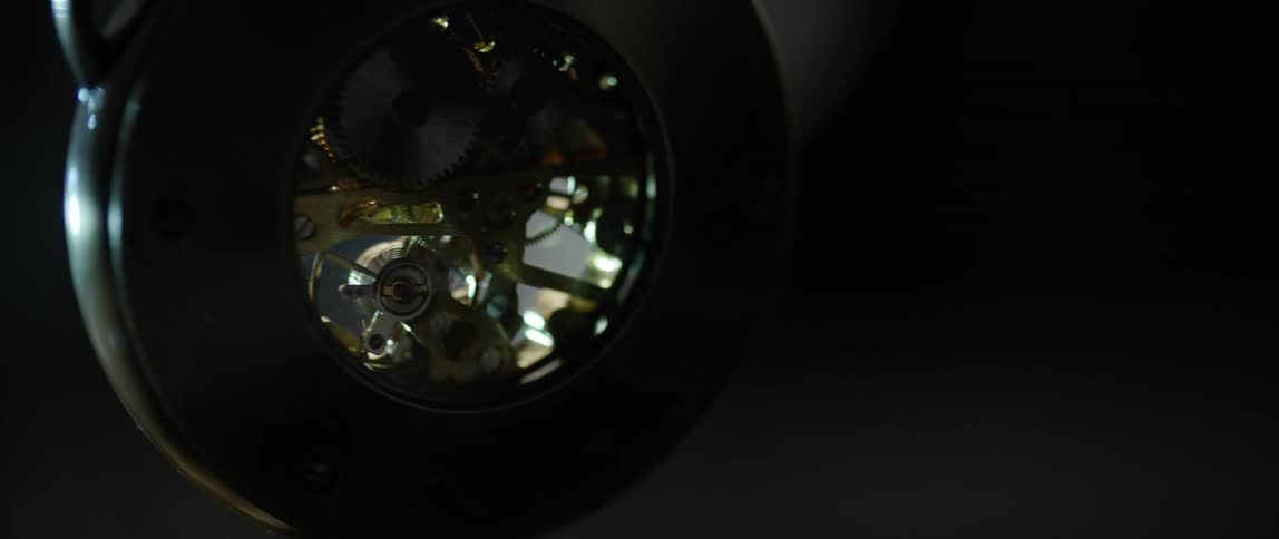 A pocket watch dangling in the air