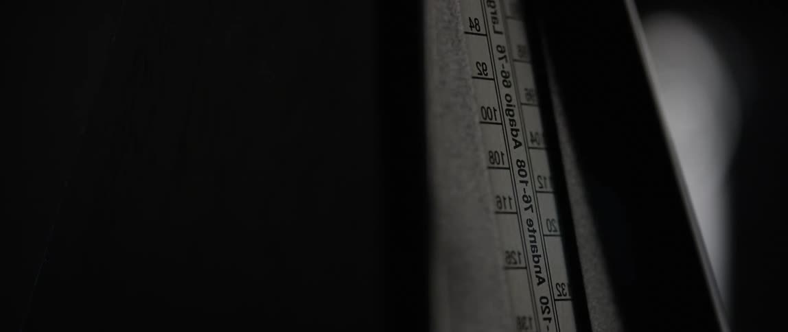 A metronome moves at a regular beat