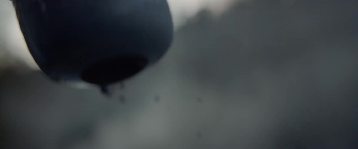 Ashes falling out of a container