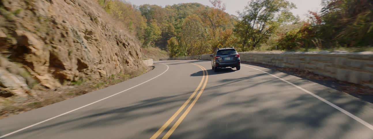 Car drives on the winding mountain highway