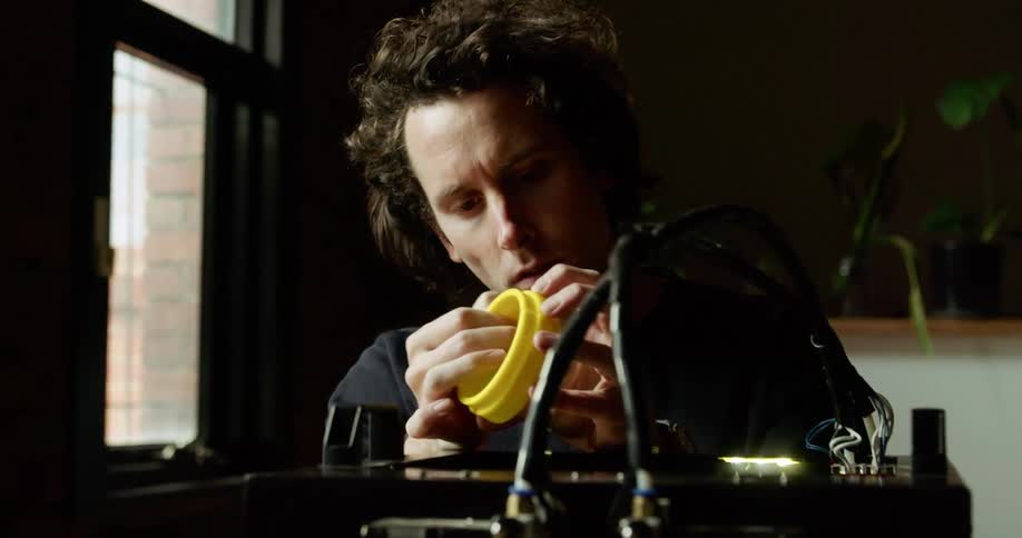 A man looks at a plastic ring