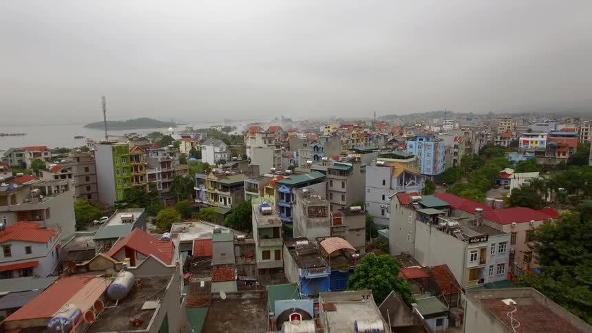 A coastal neighborhood with buildings houses and trees