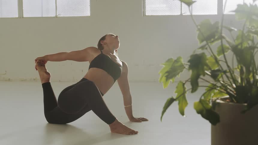 A woman stretches inside