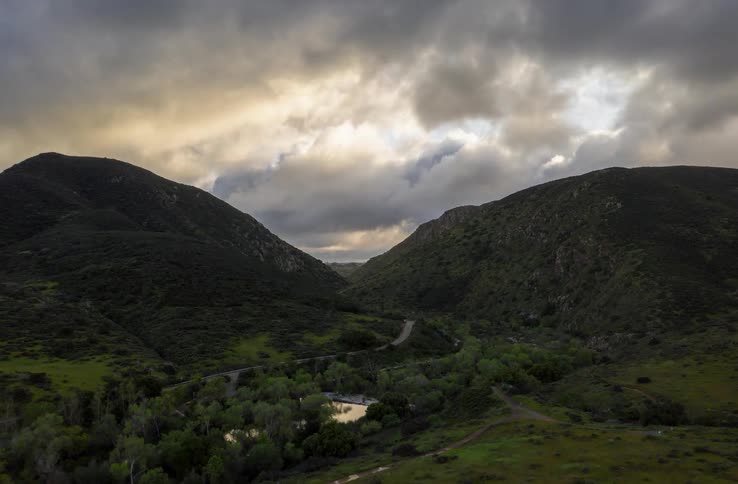 The clouds roll over the mountains