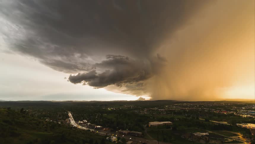 Storm clouds form over an urban area