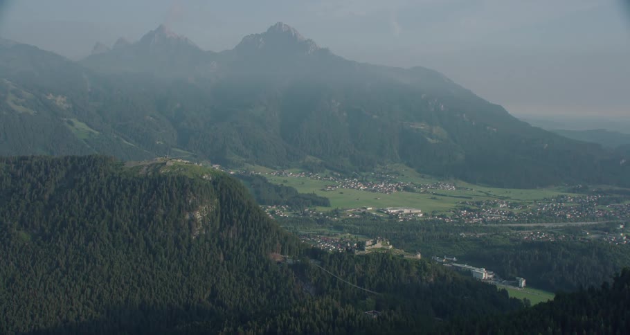 A village with mountains and the sky in the background