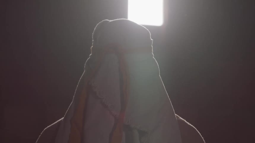 A person meditates inside