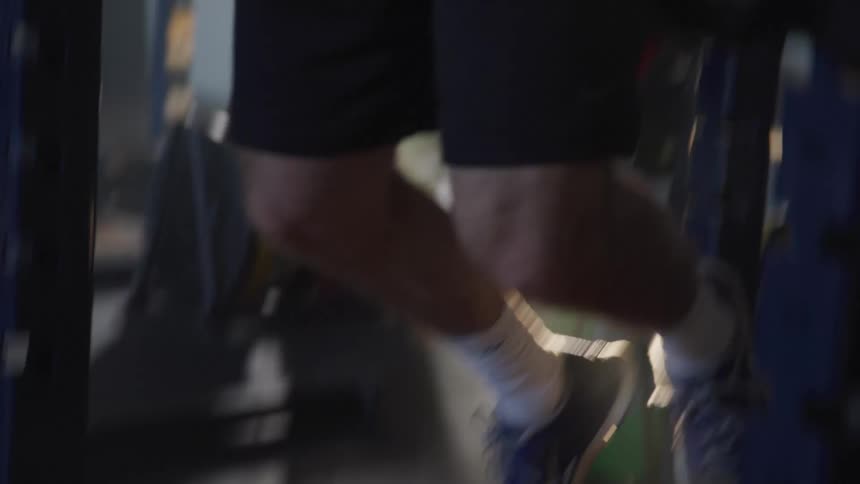 Black man exercising alone in a gym