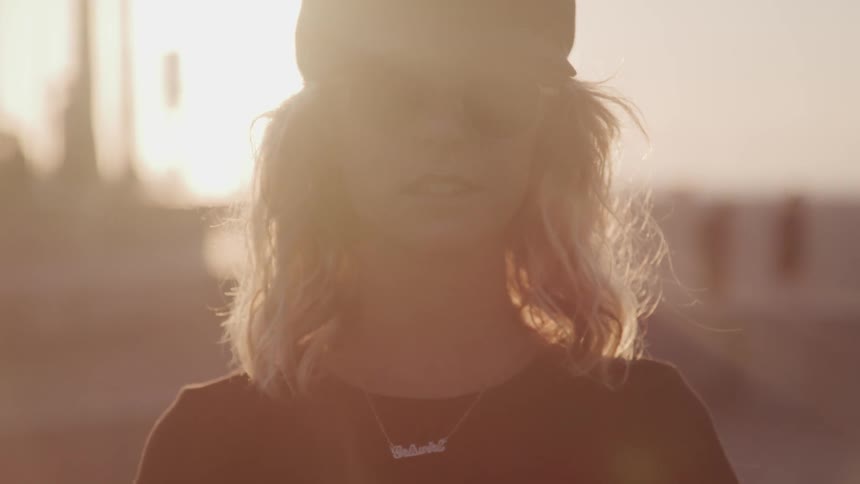 A portrait of a blonde haired female
