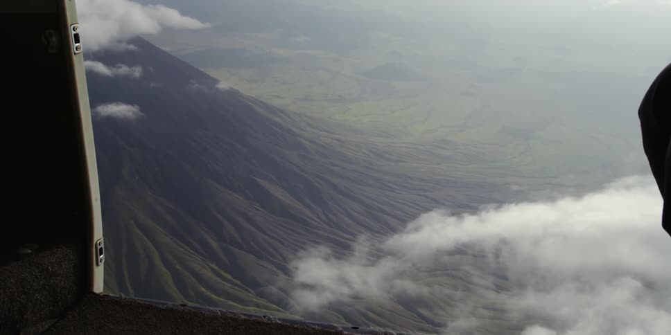 View from a plane flying over a mountain