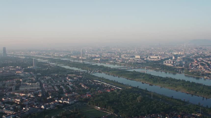Two parallel rivers with bridges and buildings