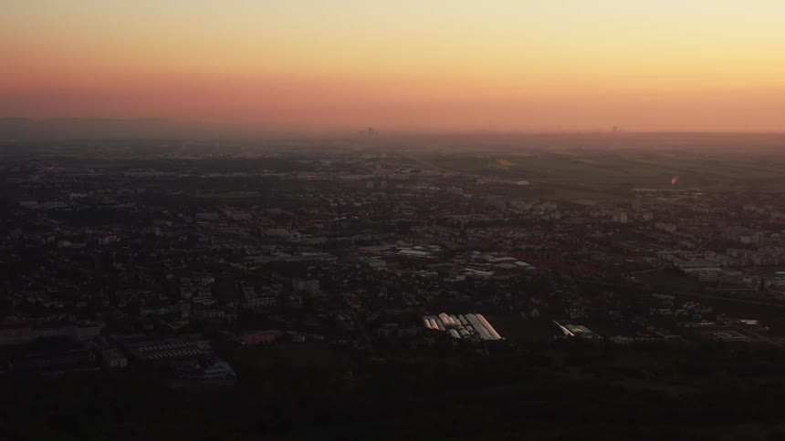 The town is covered in shade at dusk