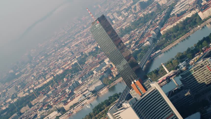 Skyscrapers and buildings in a city with a river running through it