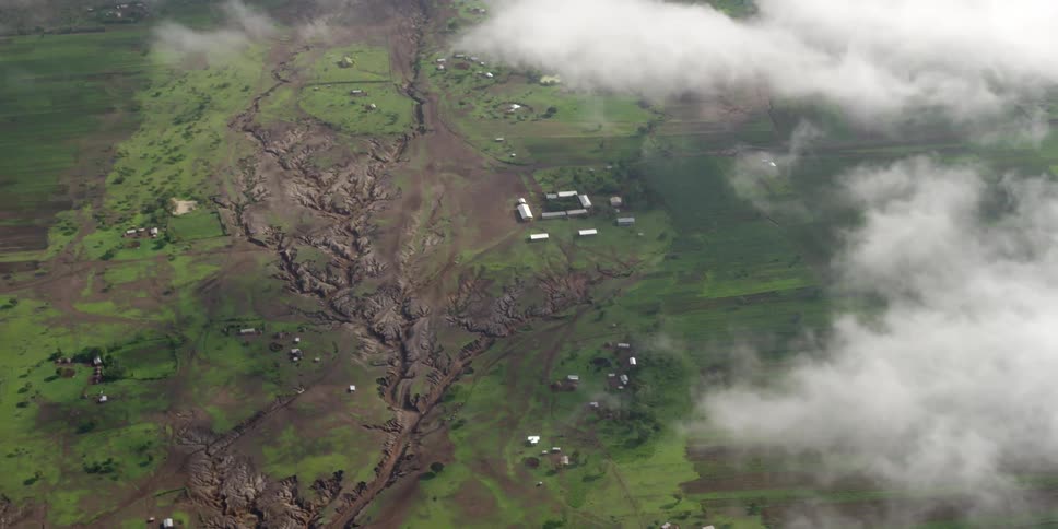 Photographers In Airplane Over African Wetlands