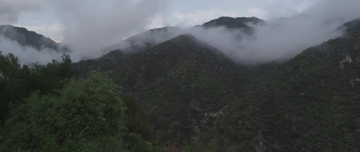 Clouds settling over mountain peaks