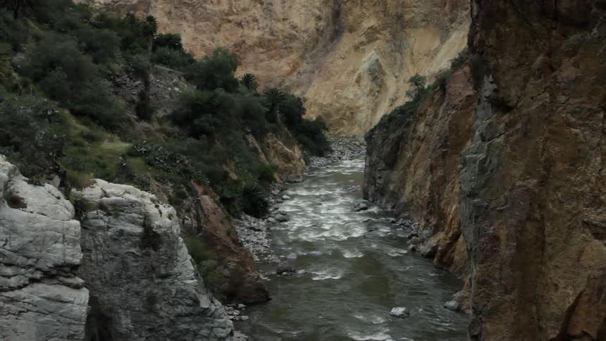 A swift moving river in a mountain valley