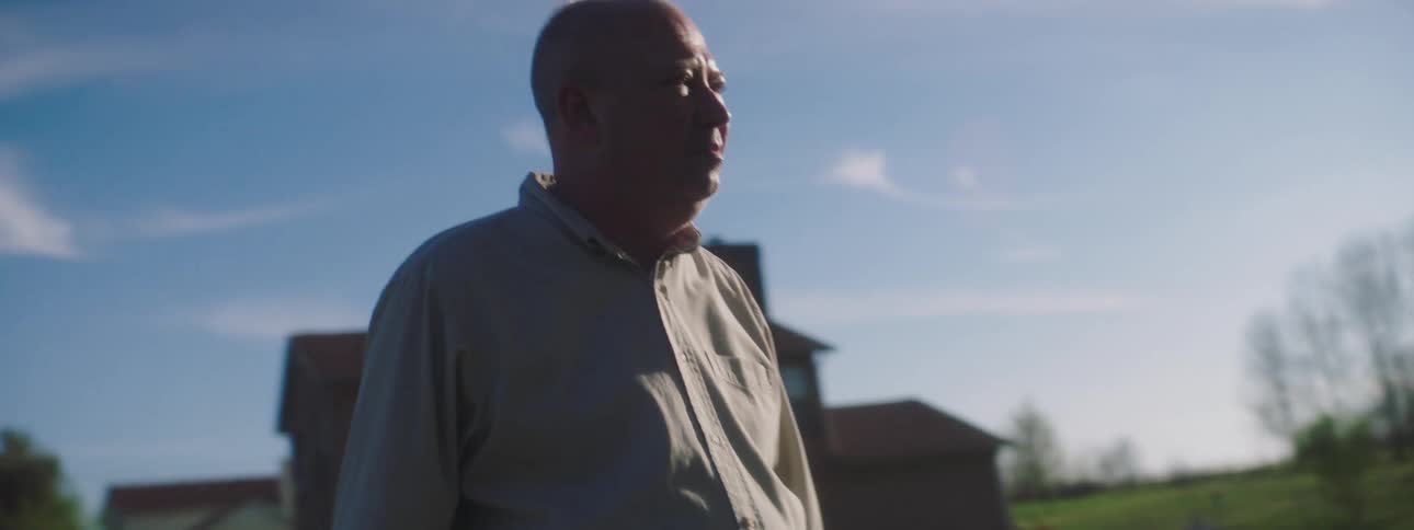 Elderly man stands and looks depressed in the garden