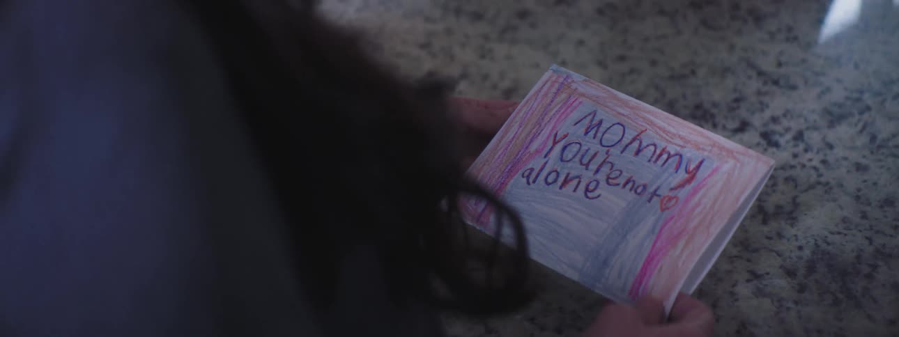 Woman accepts cheering message written by child