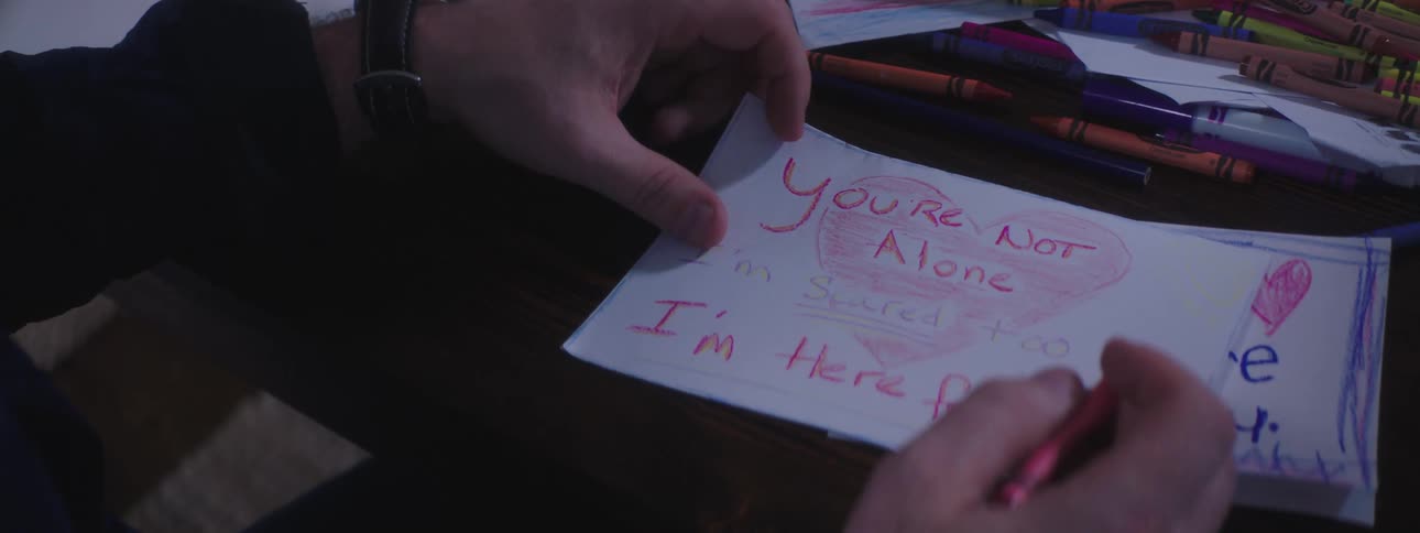 A man writes a note