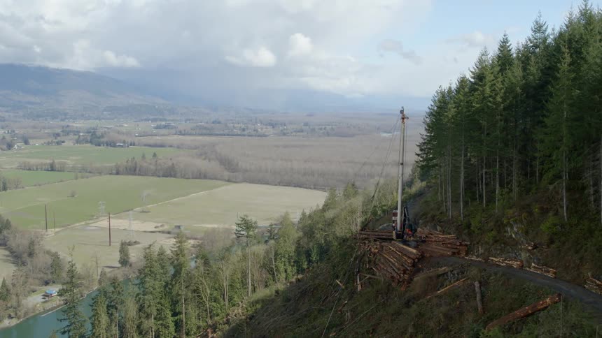 River separates logging operation from town and second mountain