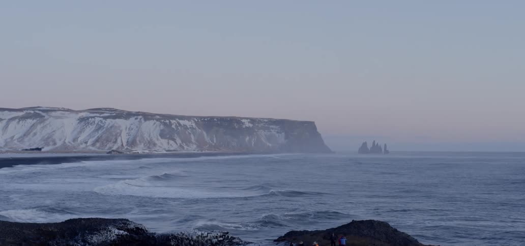 Steep cliff on coast at sunset