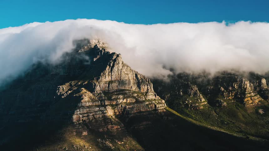 Clouds form over a mountain range
