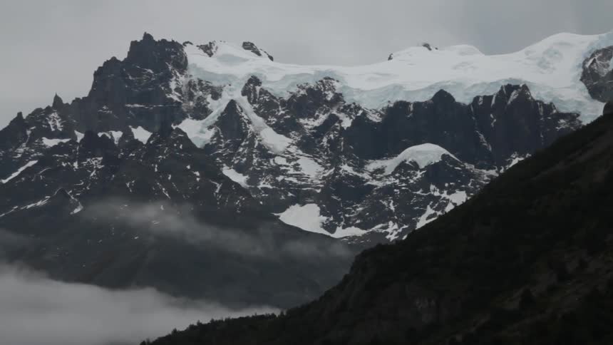 Snow covers a mountain peak