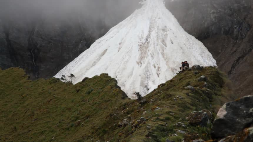 People sitting on a cliff