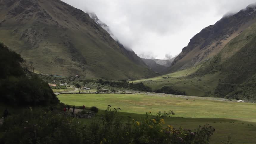 Clouds hover over mountains