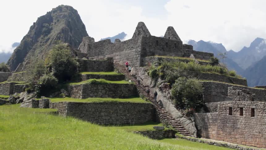 People are climbing stone steps on a cloudy day