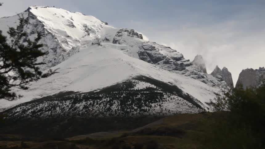 A large mountain range is covered in snow