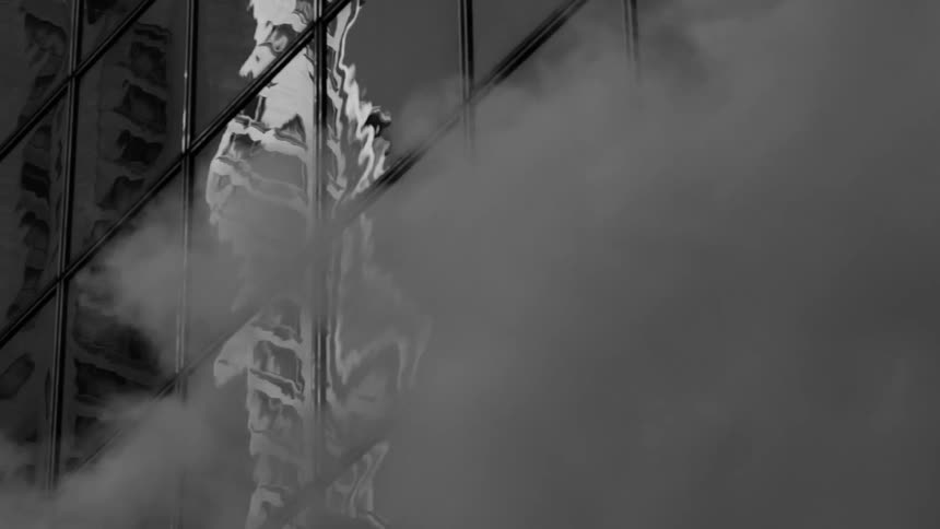 The smoke rises on the side of the building
