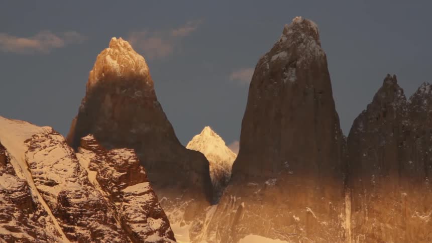 View of some tall mountains with high peaks covered in snow