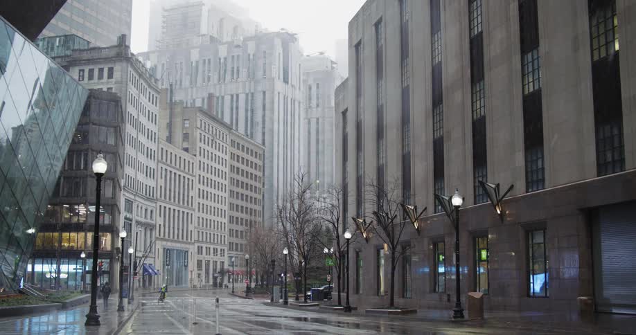 Pedestrians move through a downtown area during the winter