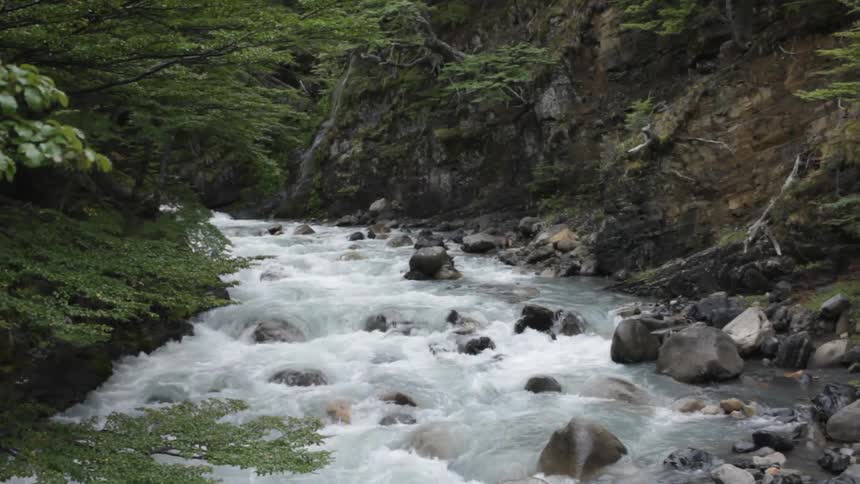 A small rapid is streaming water over rocks