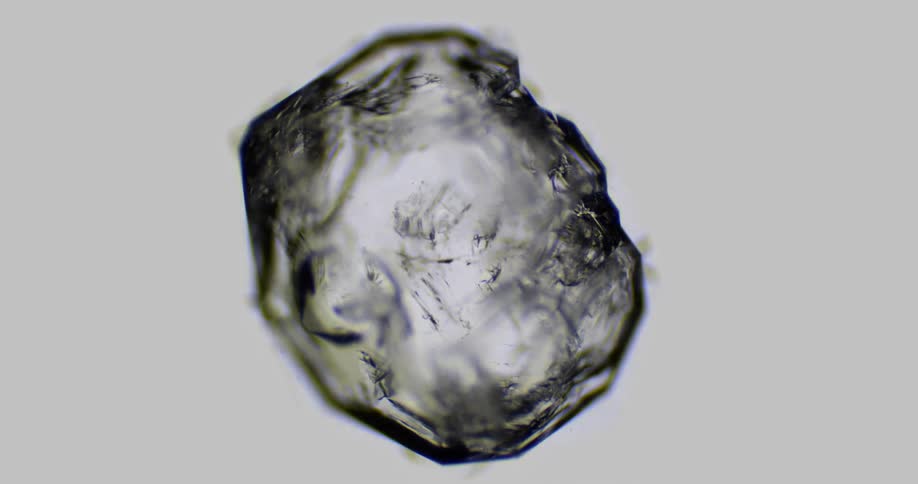 A crystal grows under water