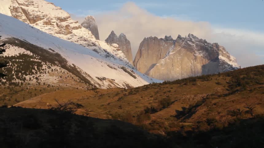 A snow covered mountain is shown