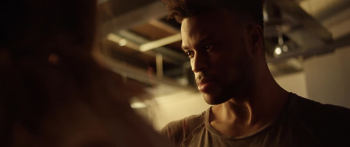 Black man looks in the eye of a white woman and turns his gaze away