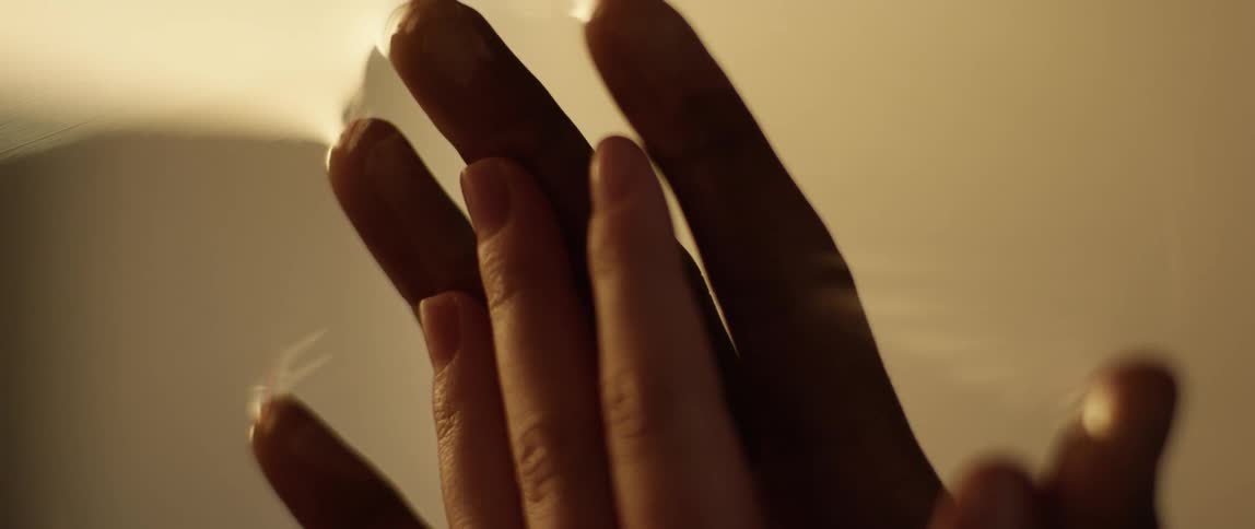 Biracial couple touch hands