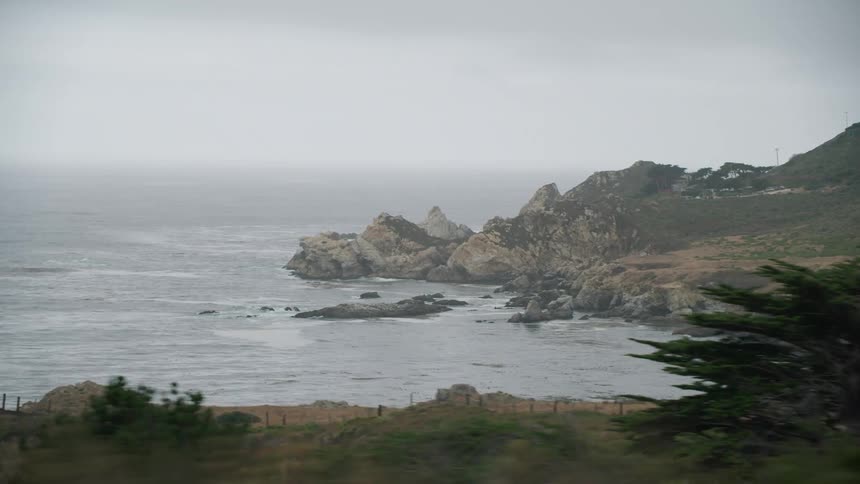The ocean waves are moving towards the coast line