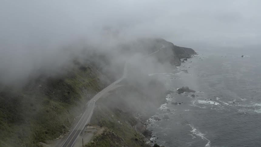 A car drives a long a coastline