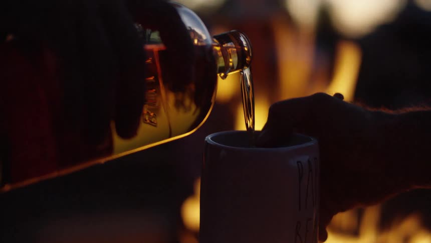 The liquid pours from the bottle