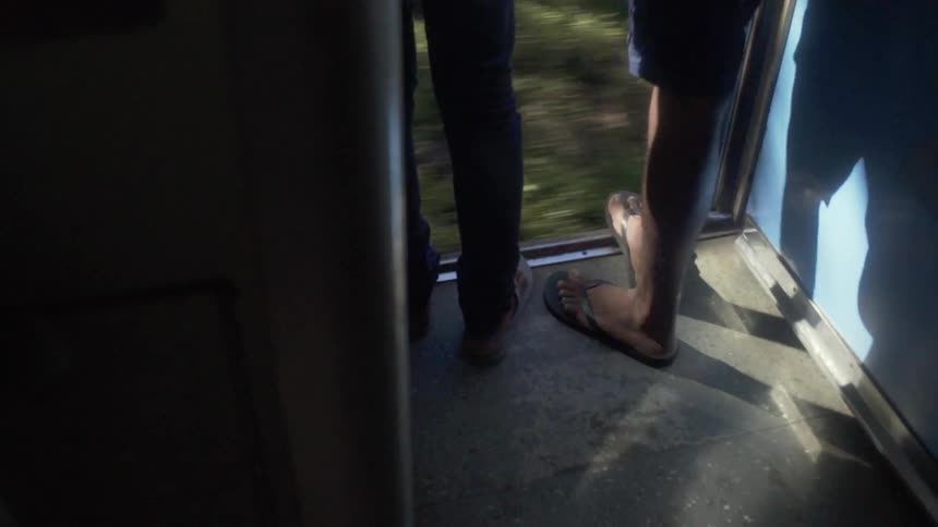 People riding a train in a third world country