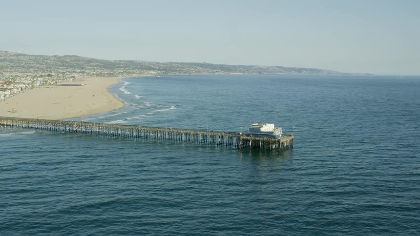 Slow motion aerial of the Newport Pier on the Balboa Peninusla